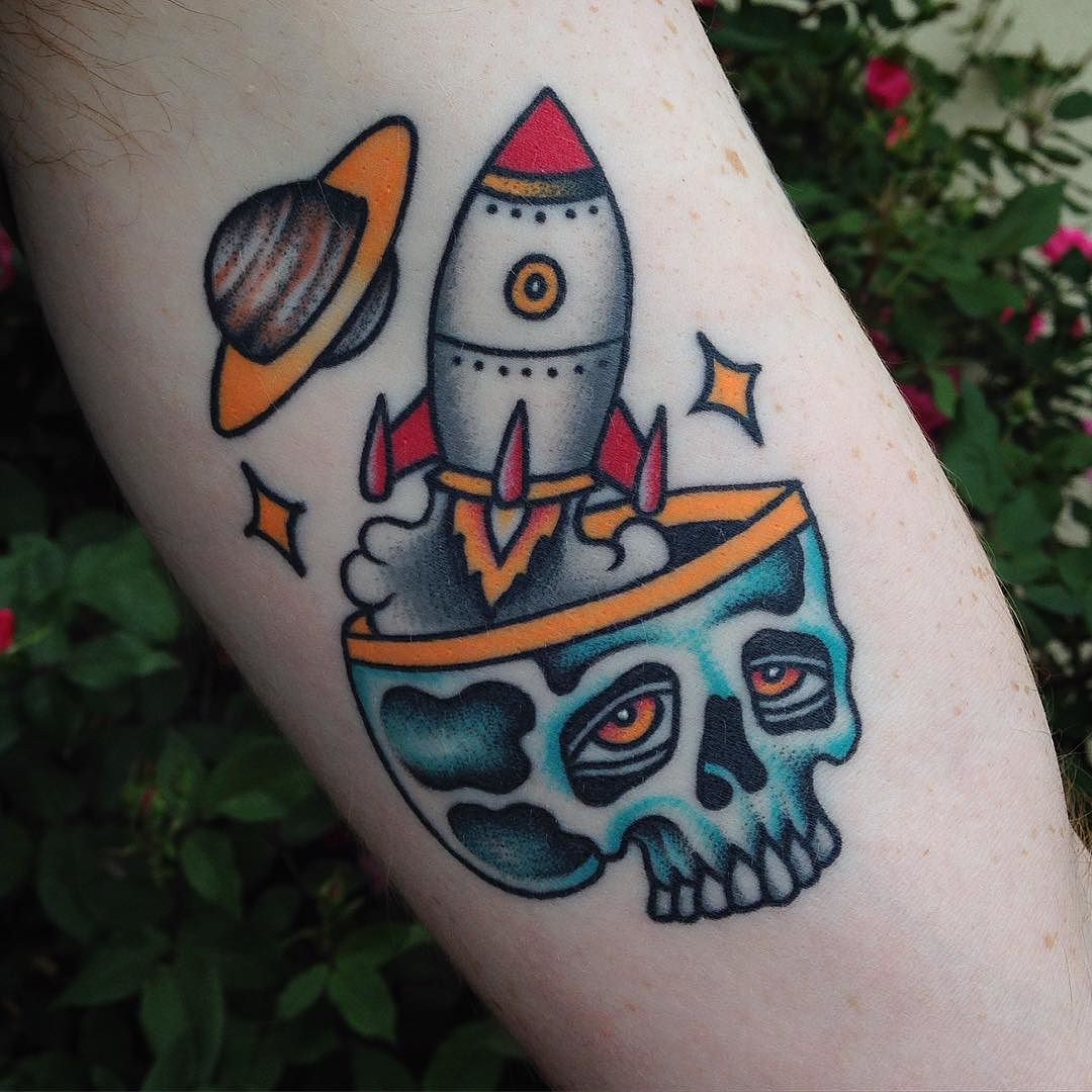 Skull and rocket tattoo
