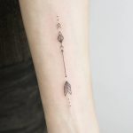 Small arrow tattoo
