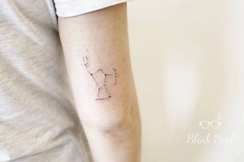 Small orion constellation tattoo on the back of the right upper arm