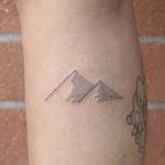 Small pyramids tattoo