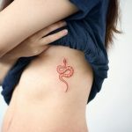 Small red snake tattoo