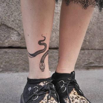 Snake tattoo on the right ankle