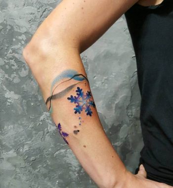 Snowflake and abstract colorful lines tattoo