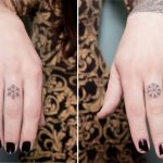 Tiny matching snowflake tattoos