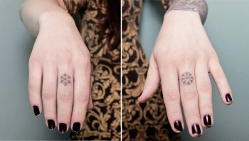 Tiny matching snowflake tattoos