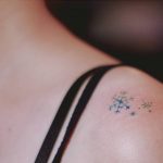 Tiny snowflakes on the shoulder