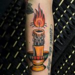 Traditional burning candle tattoo