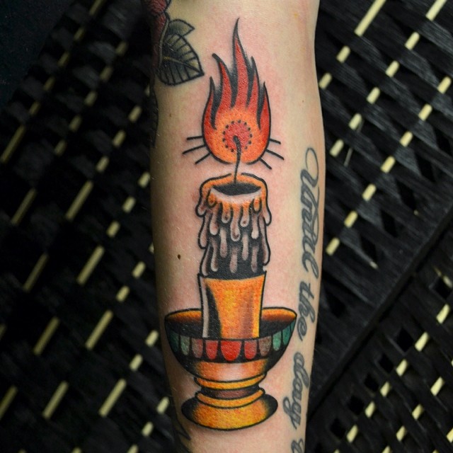 burning candle tattoo