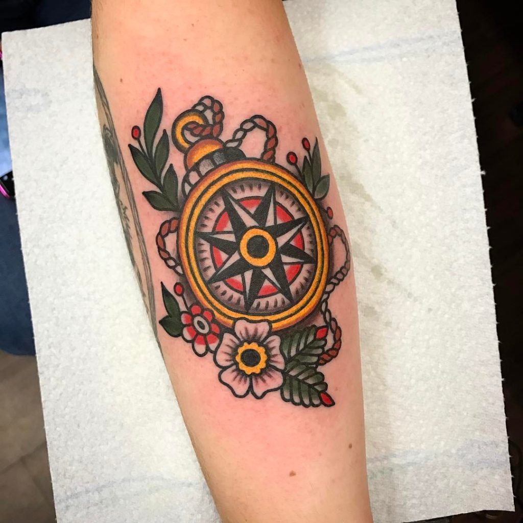Traditional compass tattoo on the forearm