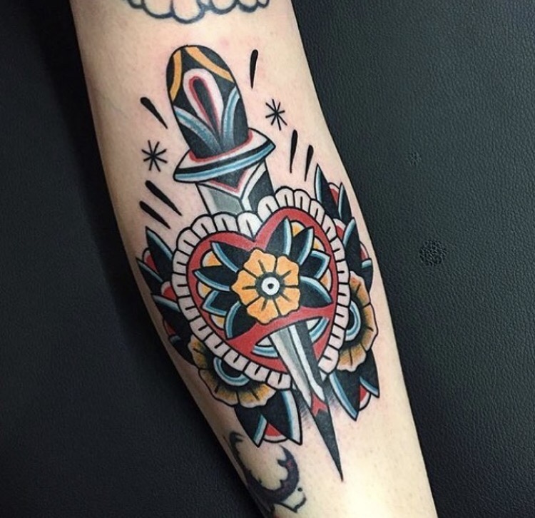 Traditional dagger heart and flowers tattoo