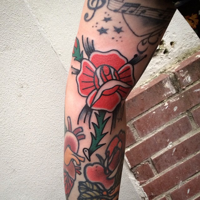 Traditional rose on the arm