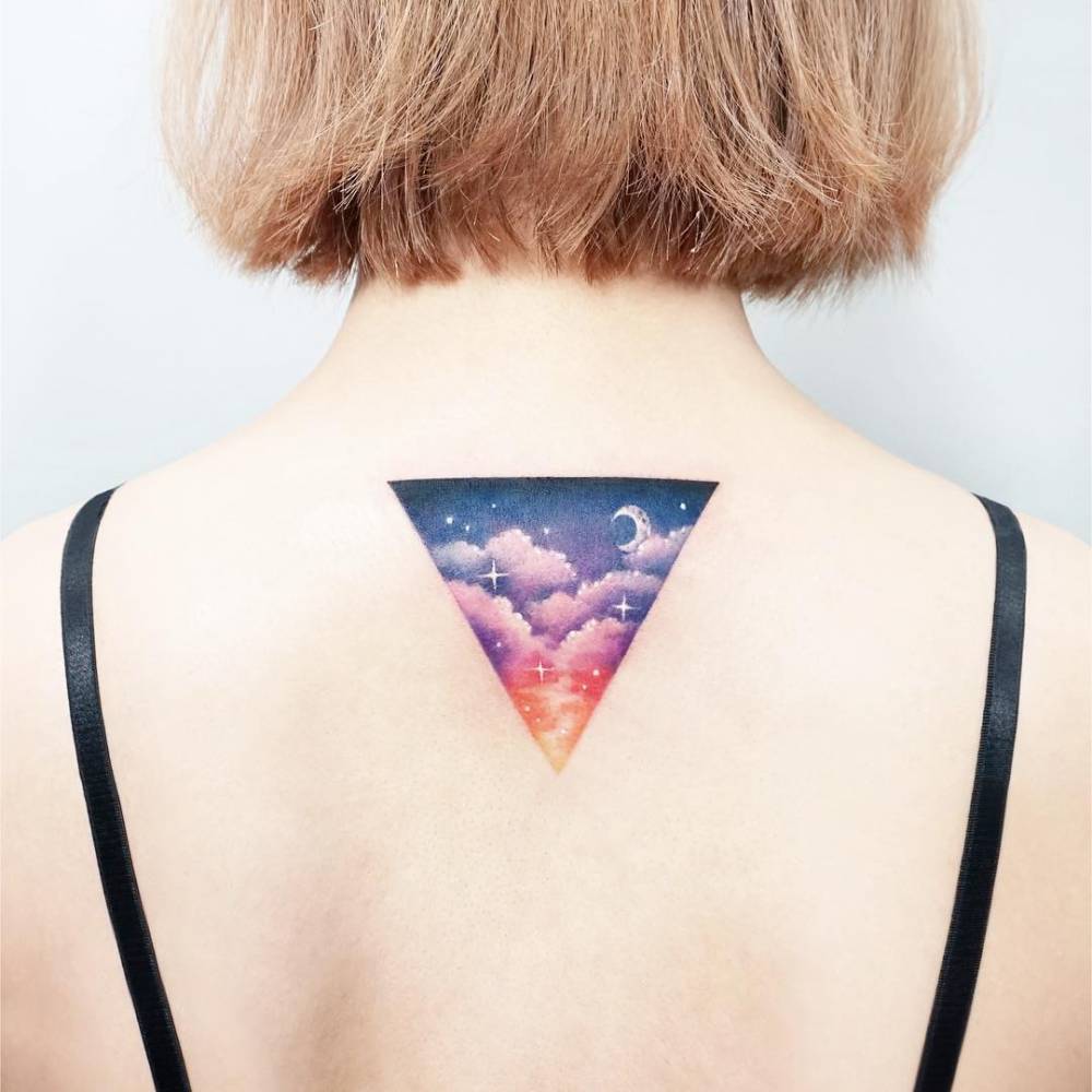 Triangular landscape tattoo on the back