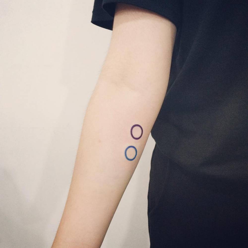 Two colorful circles tattoo 