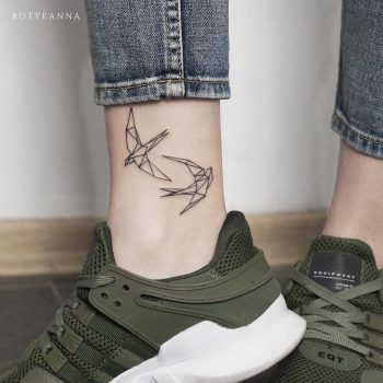 Two swallow tattoos