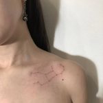 Virgo constellation tattoo on the collarbone