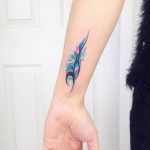 Watercolor feather tattoo