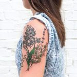 Wildflowers tattoo on the left upper arm