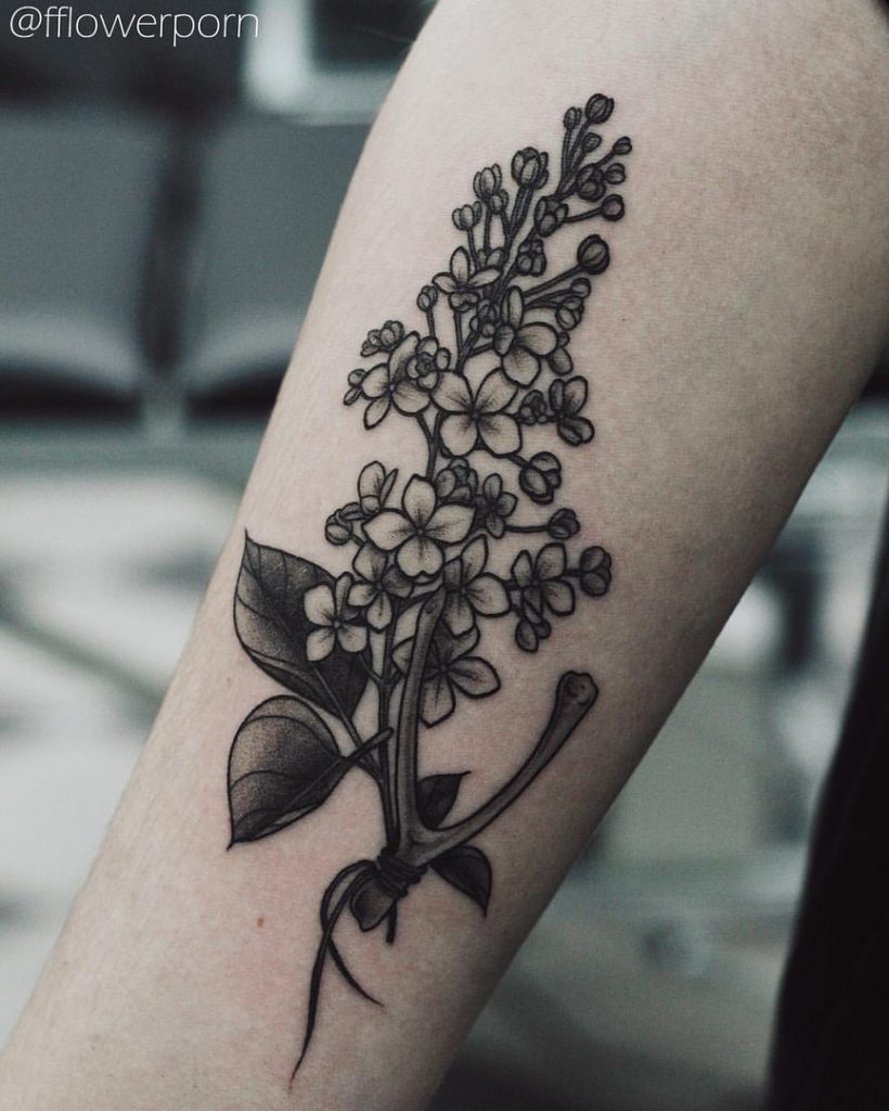 Wishbone and wildflower tattoo