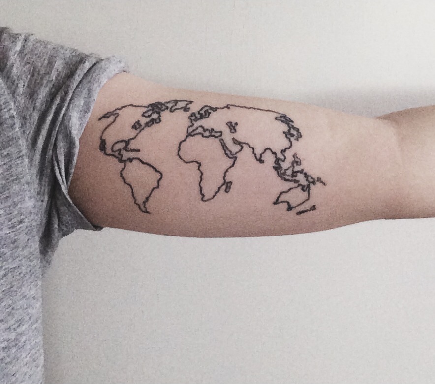 World map bicep tattoo
