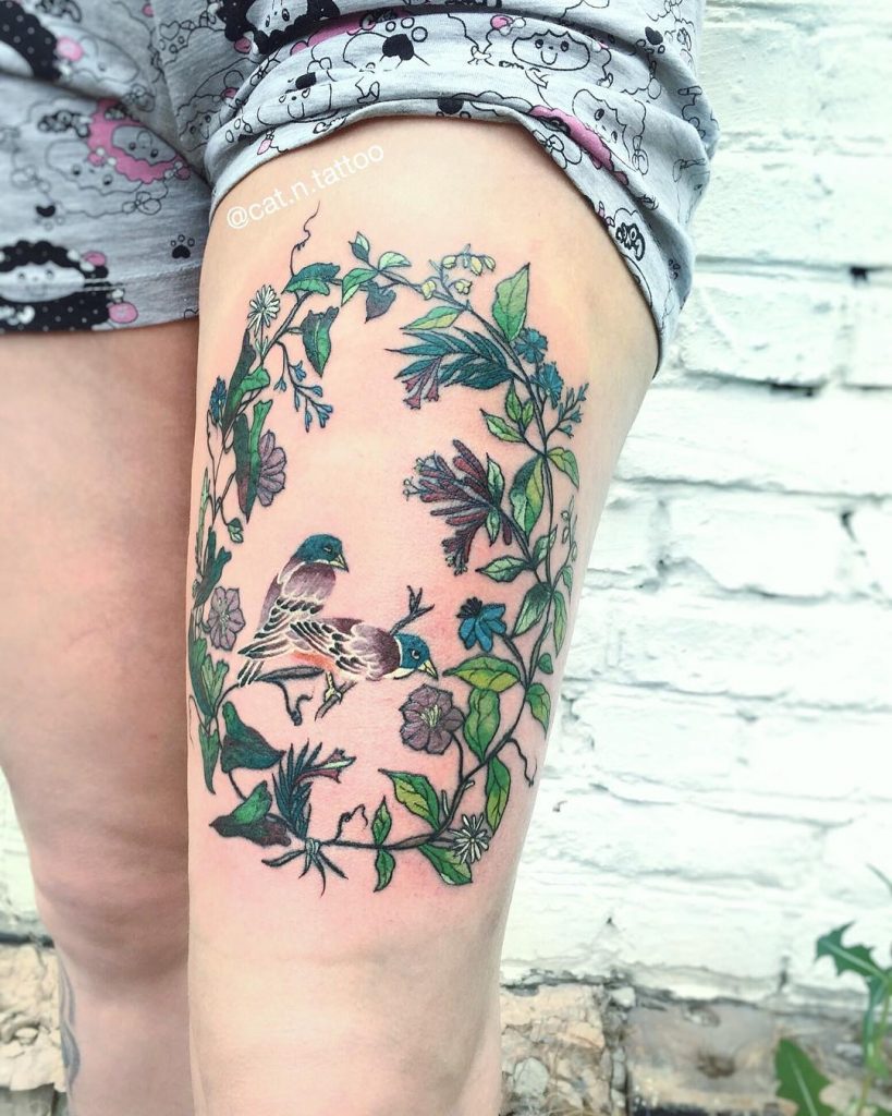 Wreath and birds tattoo