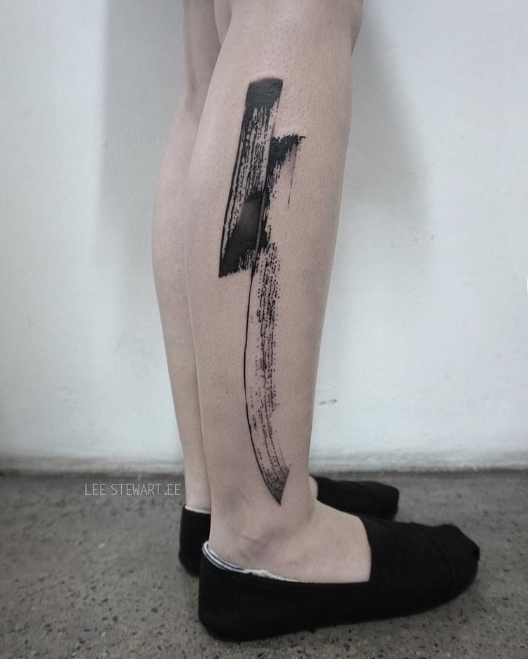 Abstract black tattoo on the right calf