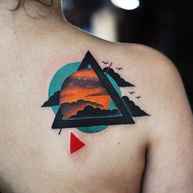 Abstract clouds and triangle tattoo