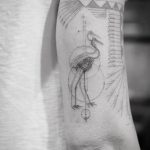 Abstract crane tattoo