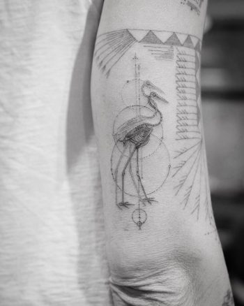 Abstract crane tattoo
