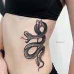Arrow and snake tattoo