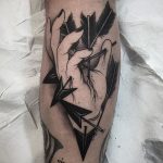 Arrow stabbed hand tattoo