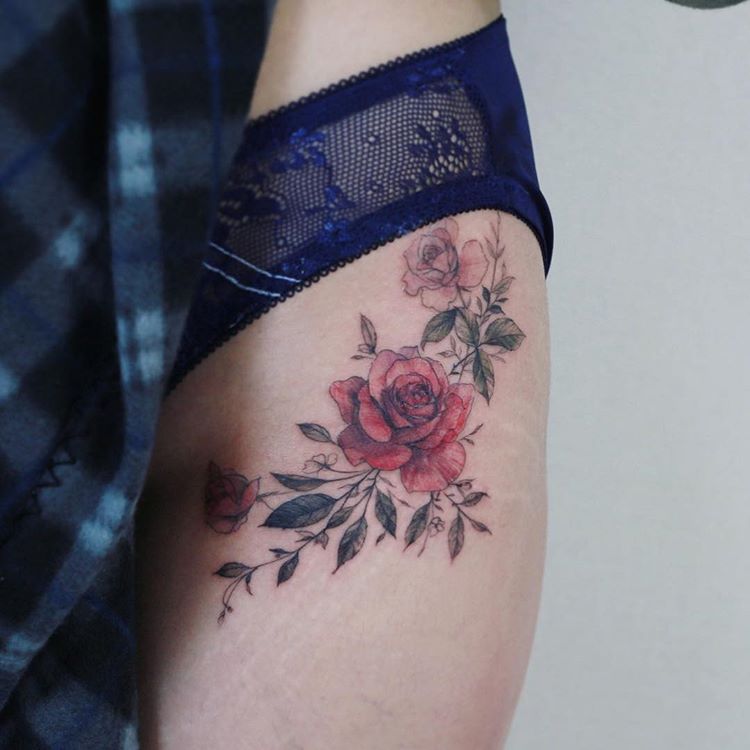 Beautiful floral tattoo on the left hip
