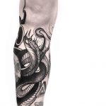 Black abstract snake tattoo