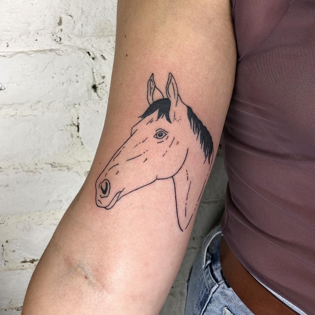 Black and grey horse tattoo
