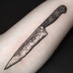 Black and grey knife tattoo
