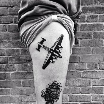 Black and white plane tattoo