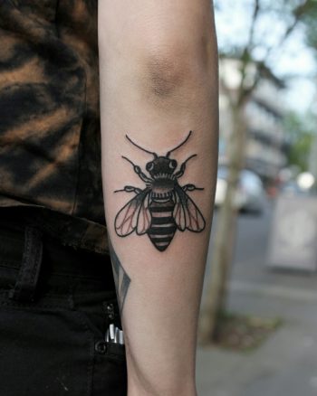 Black bee tattoo