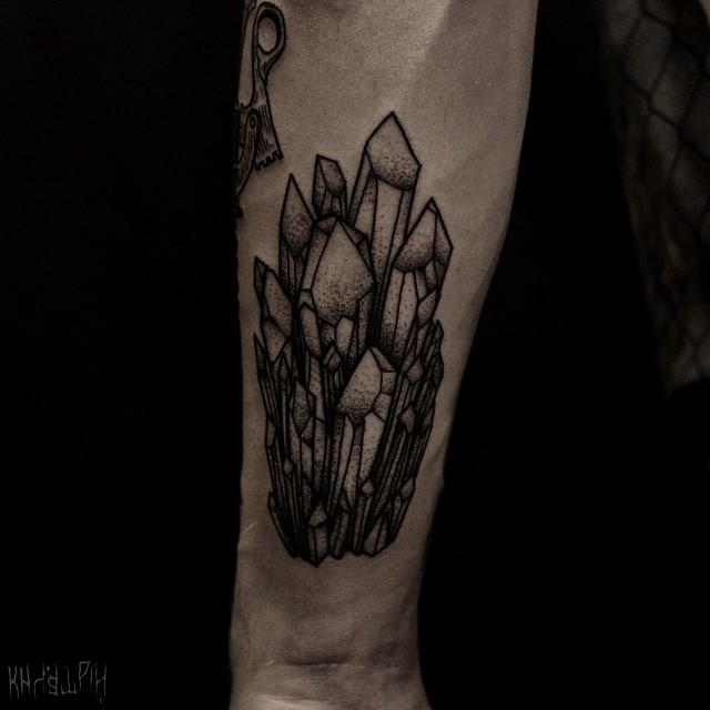 Black crystal cluster forearm tattoo
