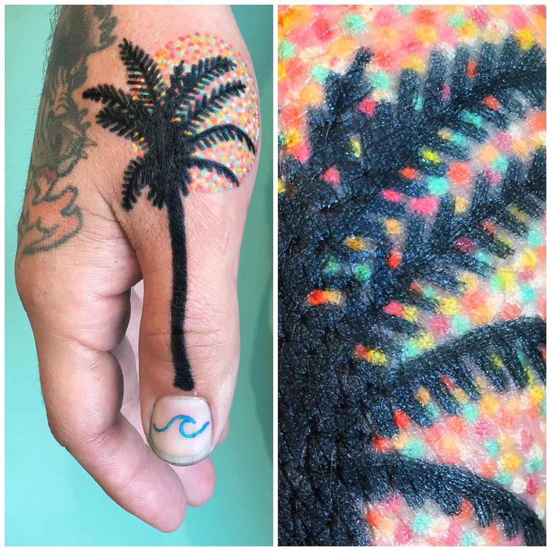 Black palm tree and sun tattoo