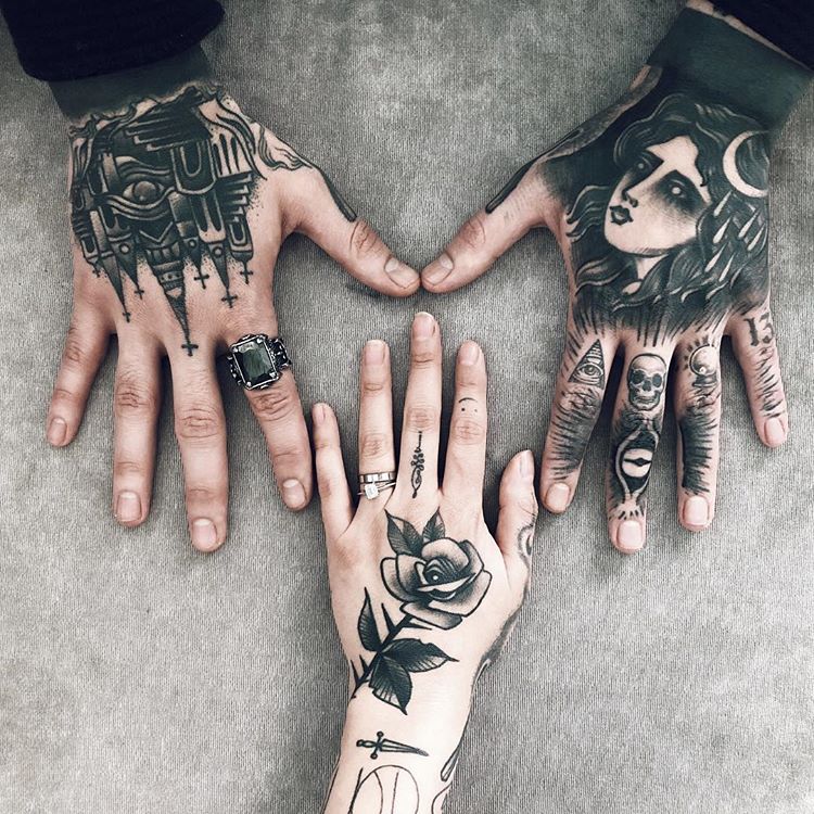 Black tattoos on hands for a couple