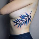 Blue and violet branch tattoo
