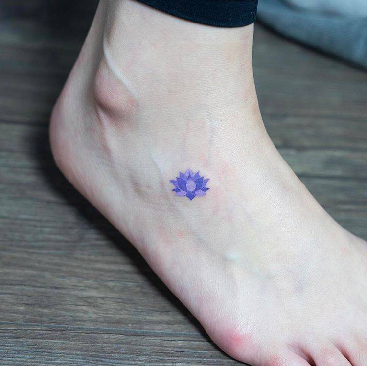 Blue lotus flower tattoo on the foot - Tattoogrid.net
