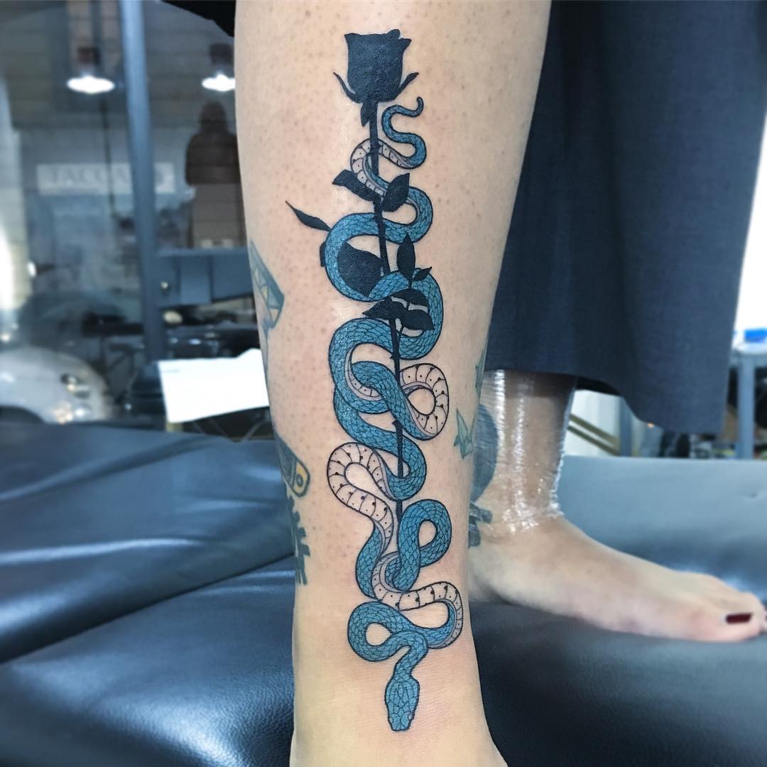 Blue snake and rose tattoo