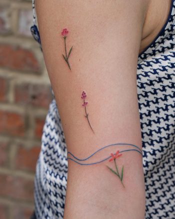 Blue wave and three flowers tattoo