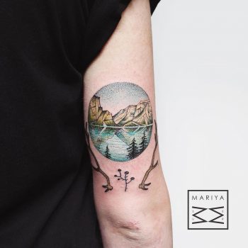 Circular mountainous landscape with a lake