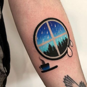 Circular window and coffee cup tattoo