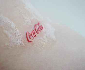 Coca cola logo tattoo