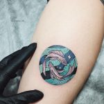 Colorful pisces tattoo