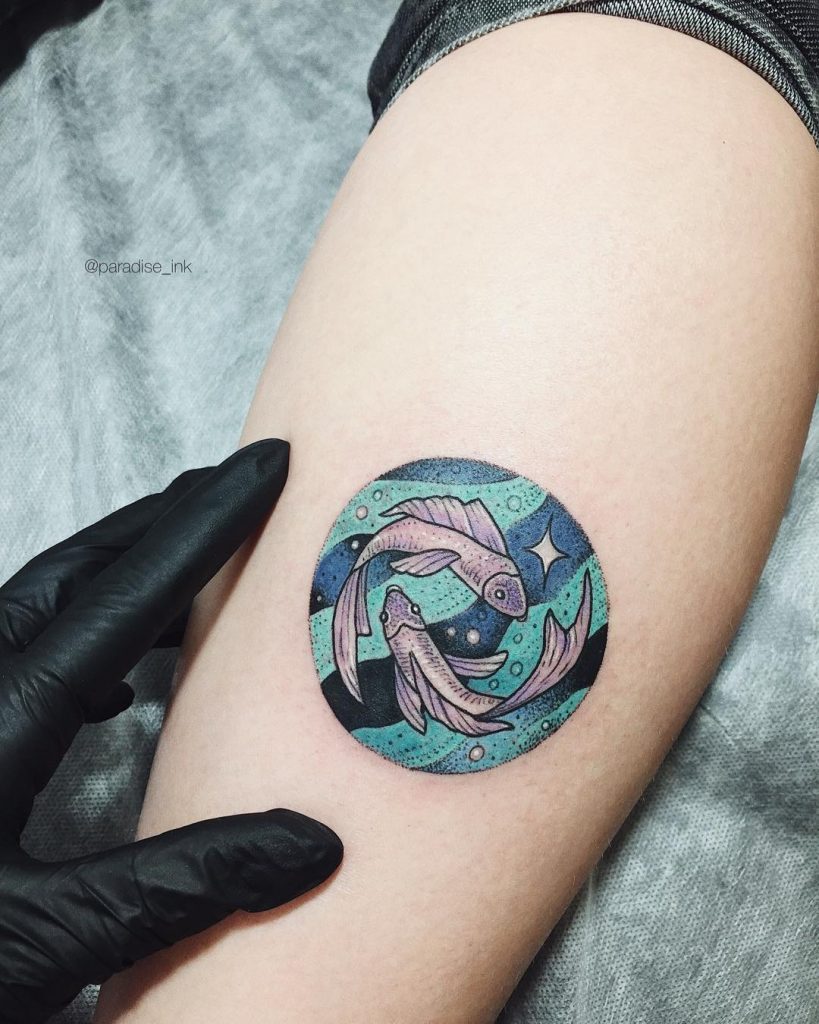 Colorful pisces tattoo