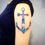 Colorful anchor tattoo on the arm