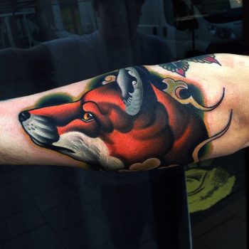 Colorful fox tattoo on the arm
